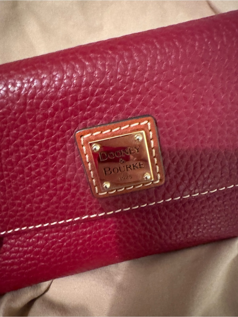 Dooney & Bourke Pebbled Leather Wallet in Berry Red with Brass Plaque